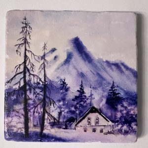 Stone Coaster with Chalet among Mountains